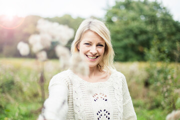 Portrait of happy blond woman outdoors