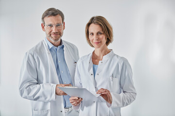 Portrait of doctors with anamnesis questionnaire