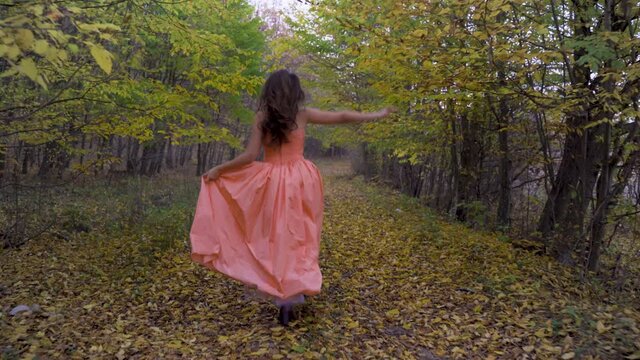 Young woman in the forest during autumn