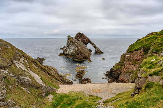 Natural arch Bow Fiddle Rock, Portnockie, Moray Firth, UK