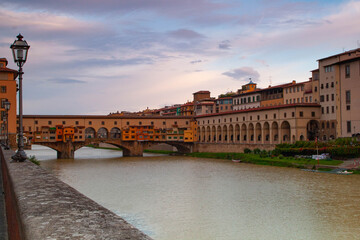 Fototapeta premium The ancient Ponte Vecchio across the river Arno in Florence, Italy