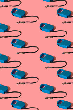 Blue retractable pet leashes on colored background