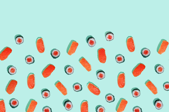 Maki pattern and salman sushi nigiri on mint green background