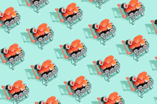 Multiple image of fresh sushi in shopping carts on mint green background