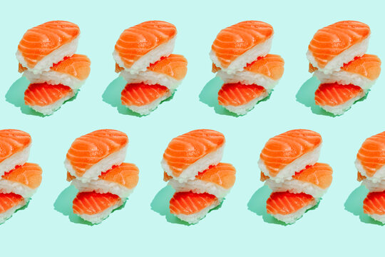 Multiple image of fresh salman sushi nigri on mint green background