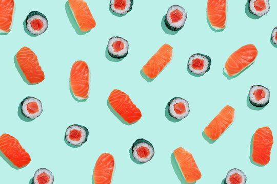 Salman sushi nigiri and maki pattern on mint green background