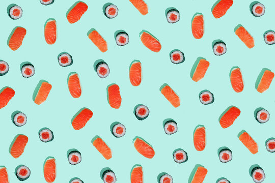 California roll and salman sushi nigiri on mint green background