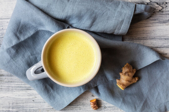 Turmeric milk with ginger and turmeric milk kept on napkin