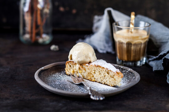 Slice of Spanish&Ocirc;&oslash;&Omega;Gato&Ocirc;&oslash;&Omega;de&Ocirc;&oslash;&Omega;Almendras&Ocirc;&oslash;&Omega;cake and glass of iced coffee