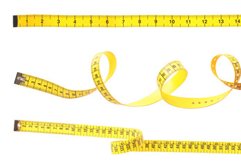 Set of yellow measuring tapes on white background