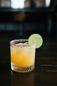 Citrus Cocktail in a Dark Bar