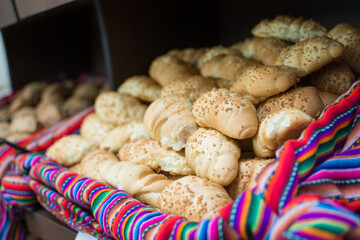 basket of buns on colorful fabric