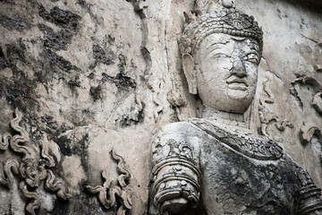 Fototapeta na wymiar A Buddha statue on the wall at Wat Sam Yot, Chiang Mai