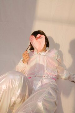 woman with white polyester track suit on white background
