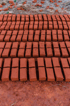 Row of adobe bricks on the floor