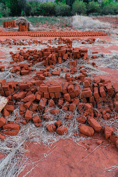 Row of adobe bricks on the floor
