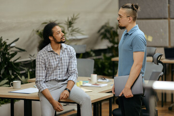 Two Relaxed Men In Office