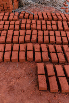 Row of adobe bricks on the floor