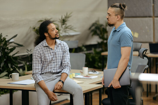 Two Relaxed Men In Office