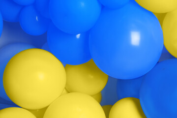Many balloons in colors of Ukrainian flag as background