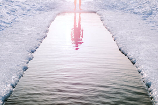 Winter swimming in cold water.