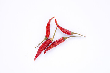 dried red chili peppers on white background