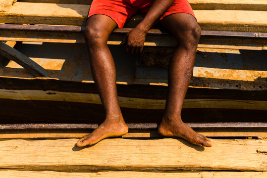 Close up of boatman foot on barge in pier