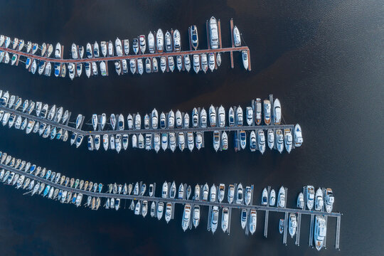aerial views over luxury yachts and boats in pens