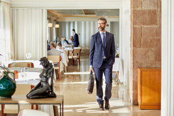 Businessman leaving restaurant