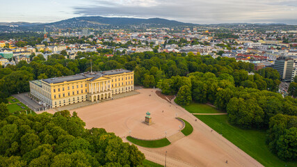 Oslo, Norway. Beautiful panoramic aerial view photo from flying drone to of the Royal Palace and Statue of King Karl Johan Oslo. In the background the castle park, the city and the mountains (Series)