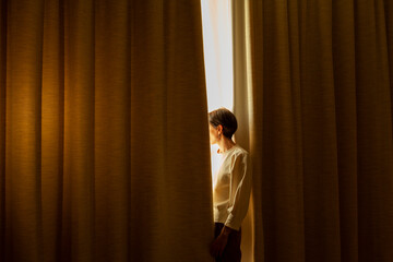 woman looking out of window