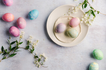 Colorful dyed eggs on plates