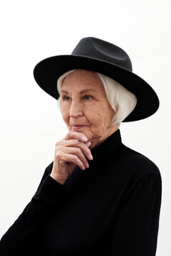 Pensive Senior Woman In Hat
