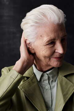 Elegant Senior Woman Fixing Hair
