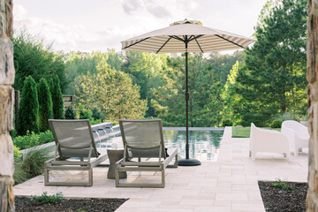 Lounge chairs by a pool
