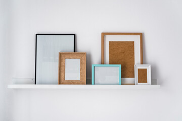 Rack of a modern flat with empty picture frames
