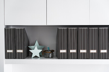 Working folders in a storage rack in a morden office