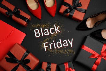 Flat lay composition with stylish women's shoes, gift boxes and phrase Black Friday on dark...
