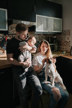 Young family and a dog at home