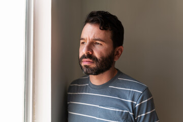 Man in his 30s suffering from loneliness at home