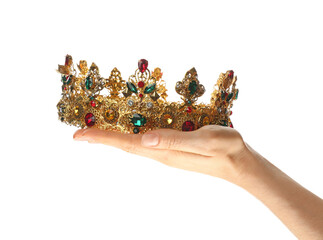 Woman holding beautiful golden crown on white background, closeup. Fantasy item