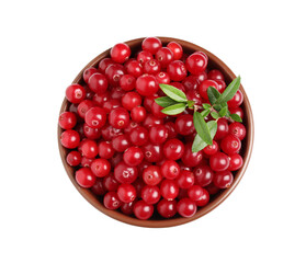 Fresh ripe cranberries with leaves in bowl isolated on white, top view