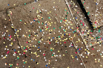 Confetti scattered on the street.