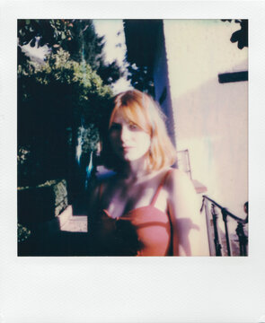 Polaroid of Attractive Redhead Woman Enjoying the Sun in Alhambra Palace