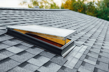 new open roof window on shingles flat polymeric roof-tiles © nikkytok