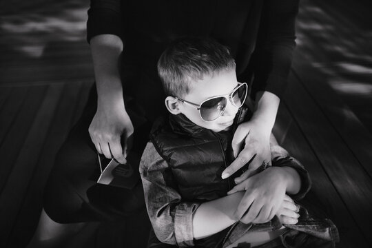 Black and white portrait of a mother with a little son.