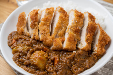 crispy chicken katsu curry on wooden board