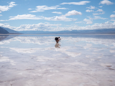 Male photographer taking picture of desolate area.