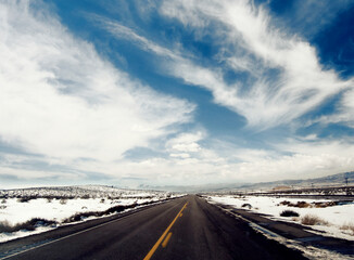 Snow-lined highway in the desert