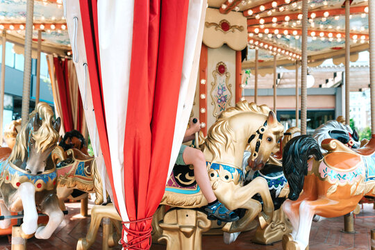 A child on the city carousel.